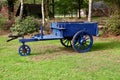 old three-wheeled cart pulled by a horse in ca. 1930 1940 in blue color