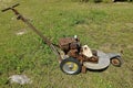 Old three wheeled lawn mower