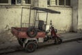 Old three-wheeler parked in the poor streets of cuba