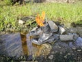 old thrown away leather boot on flame in the farm. Royalty Free Stock Photo