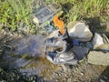 old thrown away leather boot on flame in the farm. Royalty Free Stock Photo