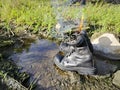 old thrown away leather boot on flame in the farm. Royalty Free Stock Photo