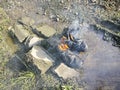 old thrown away leather boot on flame in the farm. Royalty Free Stock Photo