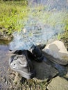 old thrown away leather boot on flame in the farm. Royalty Free Stock Photo