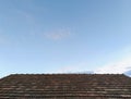 Old tile roof with clear blue sky Royalty Free Stock Photo