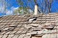 Old tiled roof with chimney Royalty Free Stock Photo