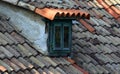 Old tiled roof and window close up Royalty Free Stock Photo