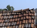 Old tiled rooftop in front of blue sky Royalty Free Stock Photo