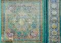 Old tiles with traditional Persian patterns on historical mosque of Iran