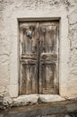 Old timber door in the scuffed wall Royalty Free Stock Photo