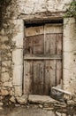 Old timber door in the scuffed wall Royalty Free Stock Photo
