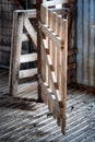 Old timber gate inside an abandoned and derelict shearing shed