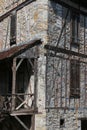 Old timbered house frontage with old furniture Royalty Free Stock Photo