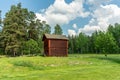 Old timbered two story barn on a green summer field in Sweden Royalty Free Stock Photo