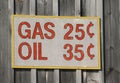 Old time sign with gas and oil prices