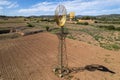 Old time windmill in field with shadow . Royalty Free Stock Photo