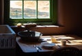 Old times farmhouse interior in a kitchen. Rural home kitchen with worn wooden table and mixing bowl, spoon, fork, plate Royalty Free Stock Photo