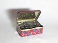 An old tin box full of Shoe nails Royalty Free Stock Photo
