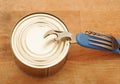 The old tin opener opening a can Royalty Free Stock Photo