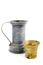 Old tin watercan and a bronze bucket on white Royalty Free Stock Photo