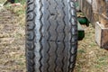 Old tire of a large tractor with cracks close-up. Big wheel Royalty Free Stock Photo