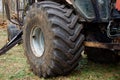 Old tire of a large tractor with cracks close-up. Big wheel Royalty Free Stock Photo