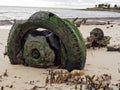 Old Tire On Rusting Axel On Beach