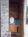 An old toilet wooden outhouse privy in the garden