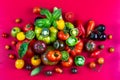 Old tomatoes stuffed, some cut in half, seen from above