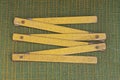 An old tool from one yellow wooden folding ruler Royalty Free Stock Photo