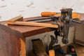 Old tools. Chisels, a screwdriver and a square are on the shelf. Planers on a wooden table Royalty Free Stock Photo