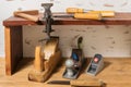 Old tools. Chisels, a screwdriver and a square are on the shelf. Planers on a wooden table Royalty Free Stock Photo