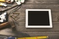 Old tools with tablet with a blank screen Royalty Free Stock Photo
