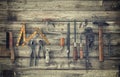 Old tools viewed from above on rough wood surface