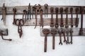 Old tools on a white wall Royalty Free Stock Photo