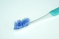 Old toothbrush close-up on white background