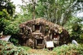 Old torajan burial site in Bori, Tana Toraja. The cemetery with coffins placed in a huge stone. Indonesia, Rantapao, Sulawesi Royalty Free Stock Photo