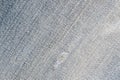 Old torn blue jeans texture close up, top view. Denim background Royalty Free Stock Photo