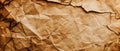 Old torn crumpled paper texture background, brown vintage sheet. Wide banner of rough worn wrapping paper or parchment. Theme of Royalty Free Stock Photo