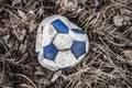 Old torn leather soccer ball blue and white Royalty Free Stock Photo