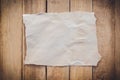 Old torn paper on wood background Royalty Free Stock Photo