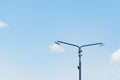 Old torn shoes hanging on a pole Royalty Free Stock Photo