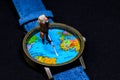 Old tourist in backpack and world map watches. Around world travel photo banner.