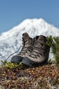 Old tourist boots on background volcano. Kamchatka Peninsula, Far East, Russia