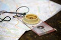 Old touristic compass on map