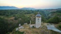 Croatia countryside at sunset with mountain view, aerial view with a drone old tower