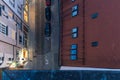 Old tower in Brno city and view down to main street from above where is car parking spots and people waling on main street during