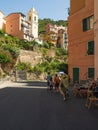 Old tower church with clock and bell in Cinque Terre National Park in Italy on city hill