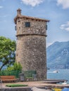 Old tower on the marina of Malcesine town, lake Garda, Italy Royalty Free Stock Photo