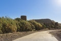 Old tower and Path to the Playazo beach in Rodalquilar, Almeria, Spain